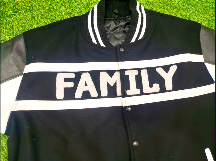 FAMILY WROTE ACROSS CHEST (CHENILLE LETTERS) INSIDE WHITE (LEATHER STRIPS)