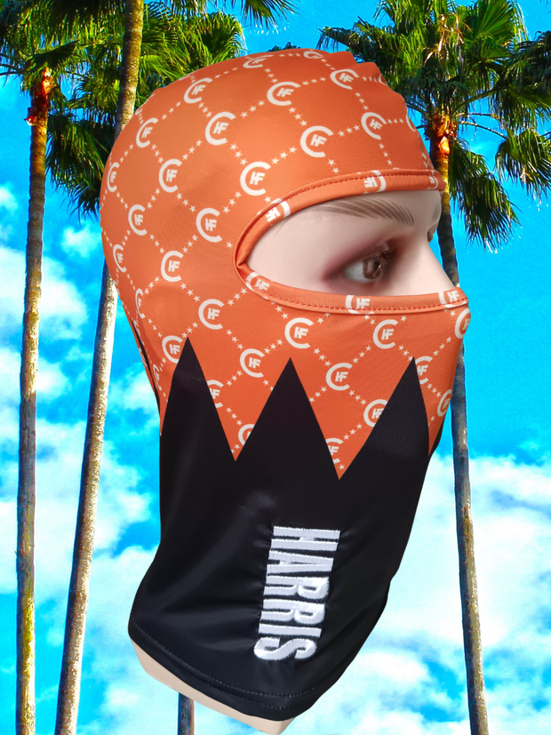 ( ORANGE ) H.F.C DESIGNER BALACLAVA ,  DISPLAYING BOLD 3-D HARRIS LOGO. ( RIGHT SIDE )