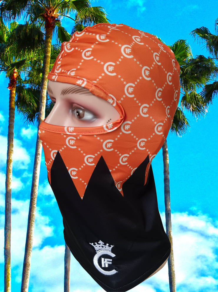 ( ORANGE ) H.F.C DESIGNER BALACLAVA ,  DISPLAYING CUSTOM 3-D EMBROIDERY H.F.C CROWN LOGO. ( LEFT SIDE )