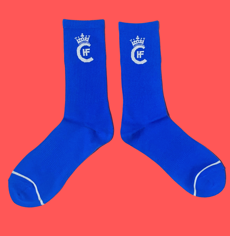 BLUE SOCKS WITH CUSTOM WHITE H.F.C CROWN LOGO.