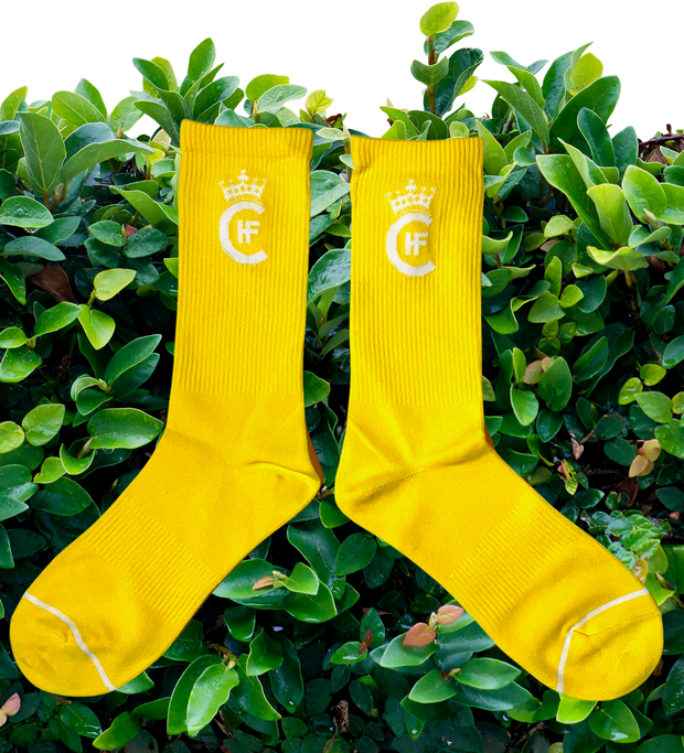 YELLOW SOCKS WITH CUSTOM WHITE H.F.C CROWN LOGO.